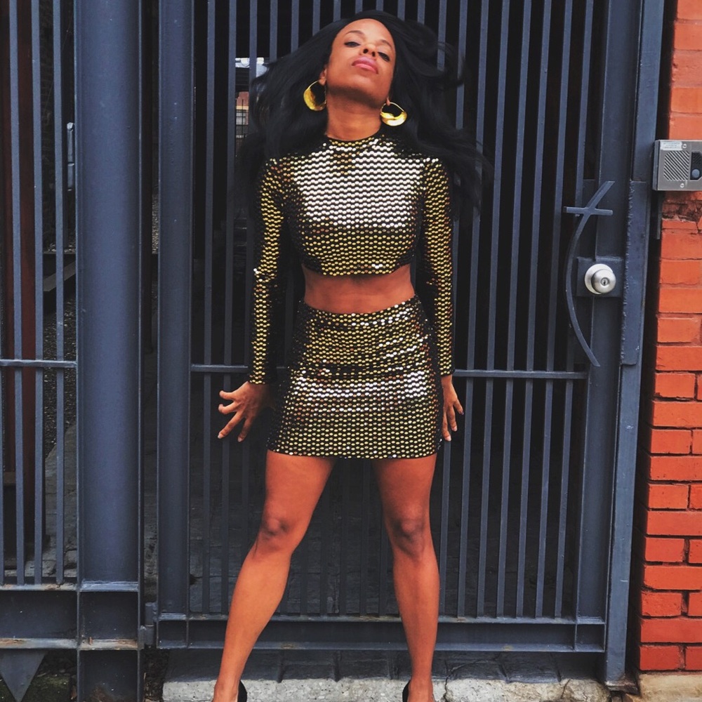 Black crop top and mini skirt with gold sequin